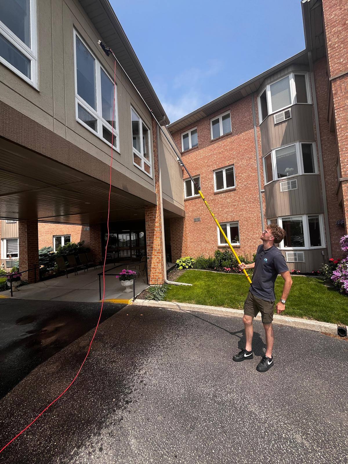 Pole and hose set up outside an apartment building
