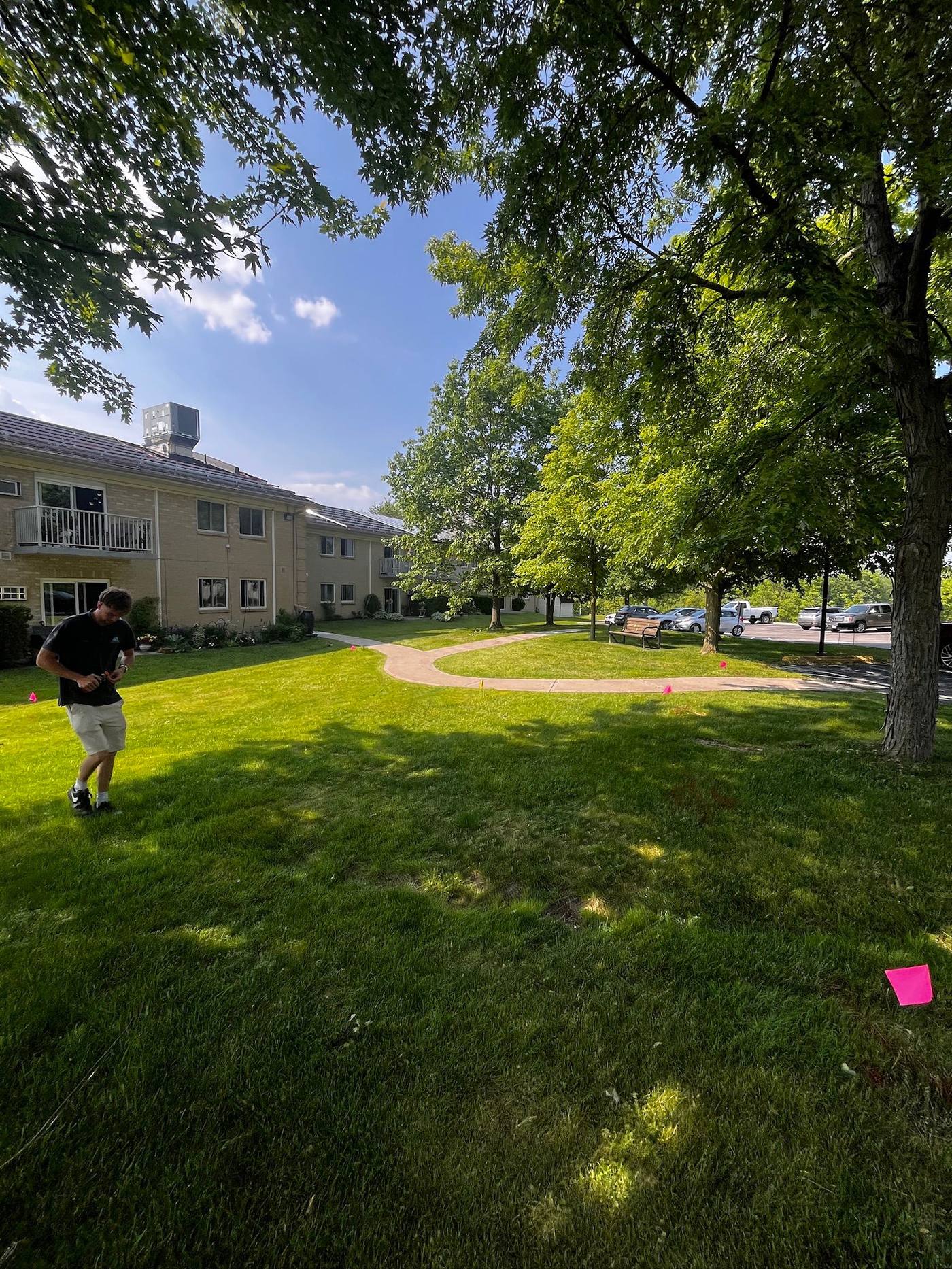 Working across the grounds of an apartment complex