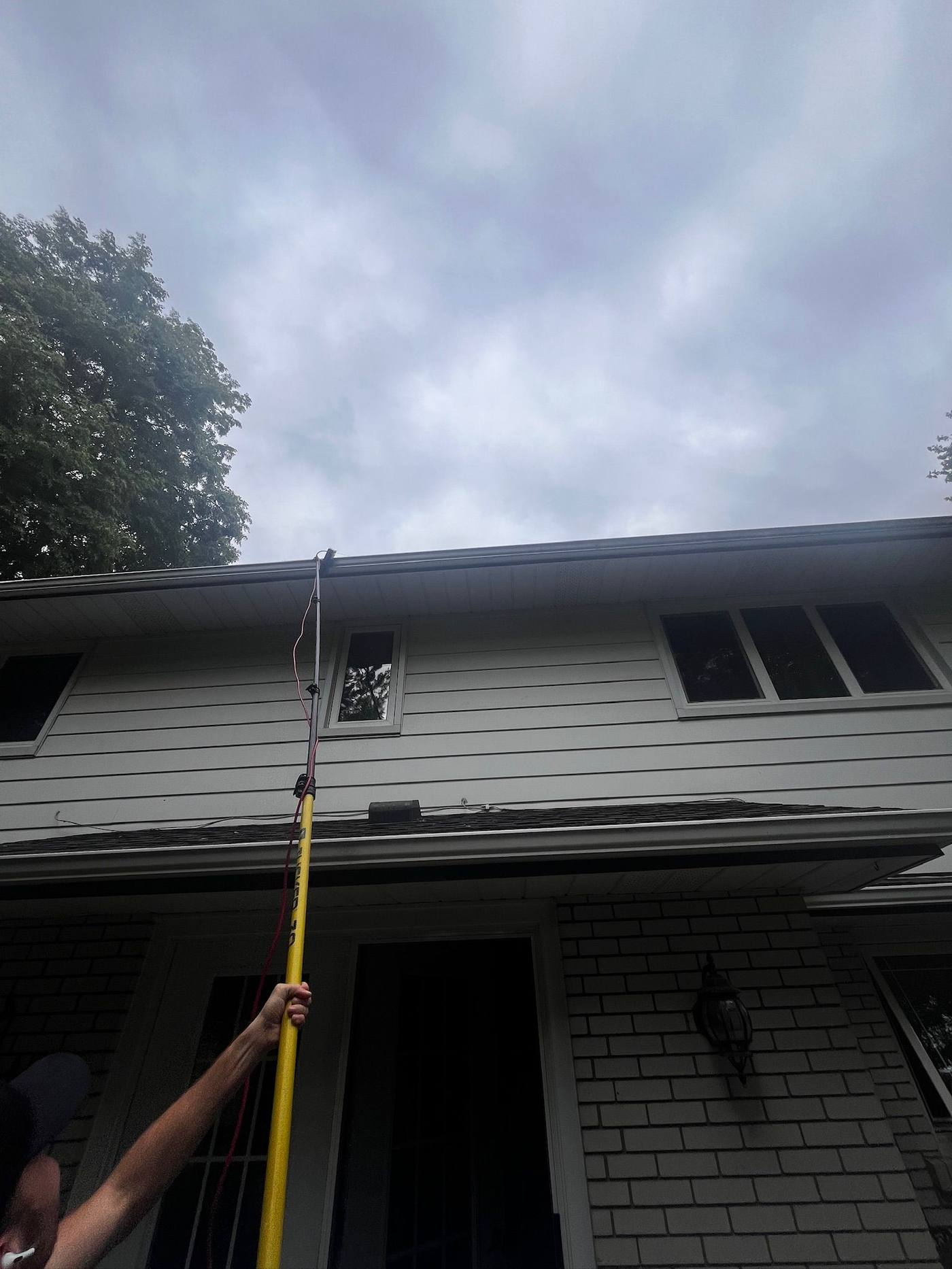 Pole work on a grey-sided home