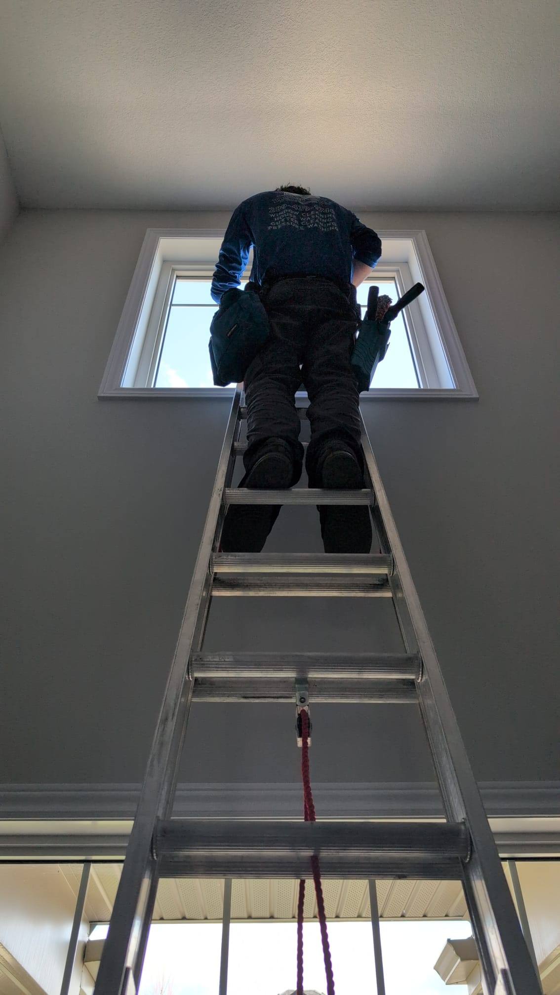 Reaching an interior skylight from a ladder